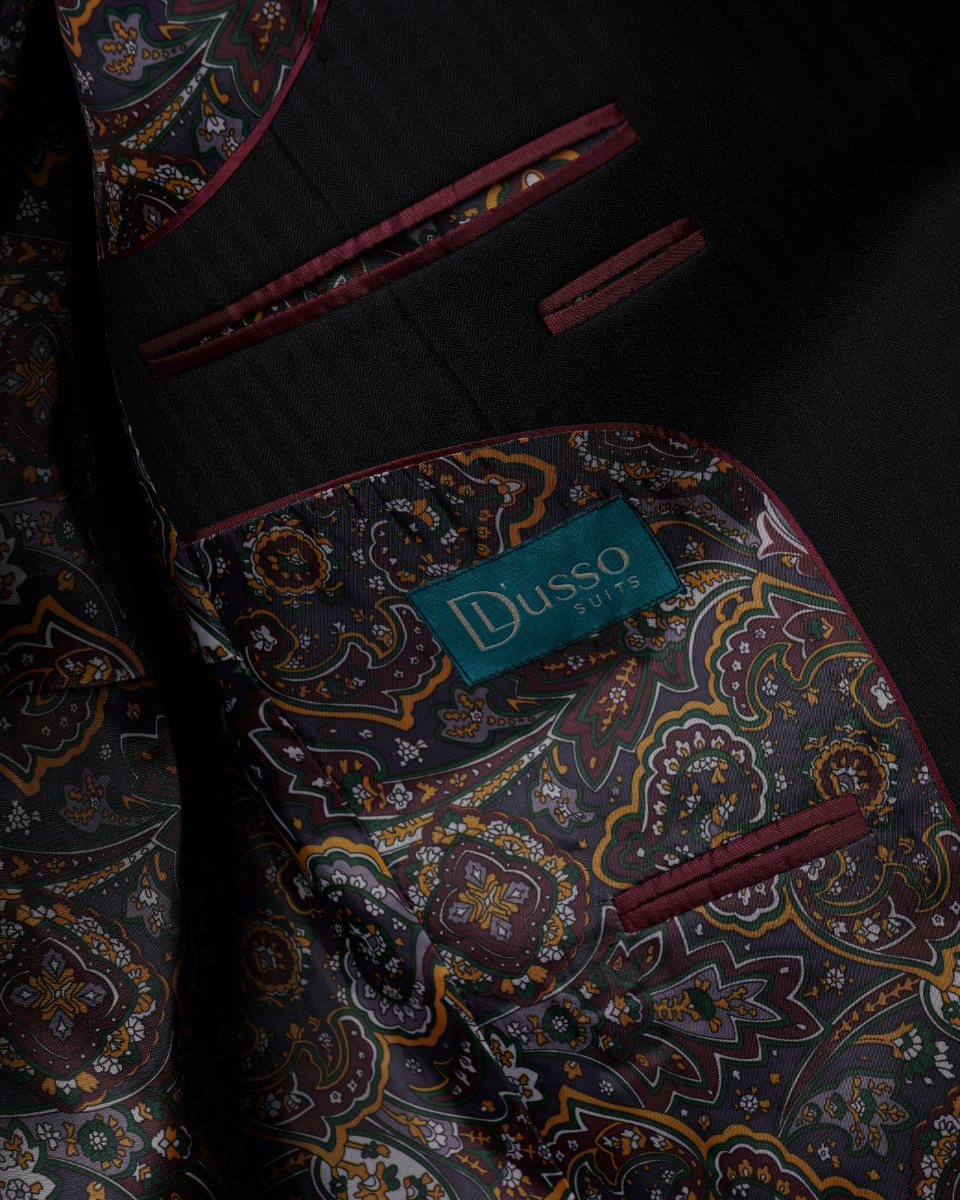 Inside the jacket — paisley lining, piped pockets and the D'Lusso woven label