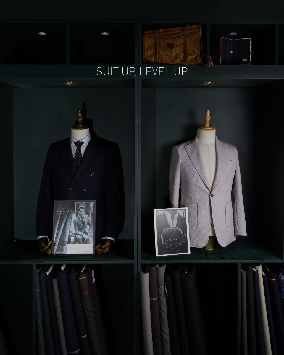Fabric selection — superfine wool books and swatches on the consultation table